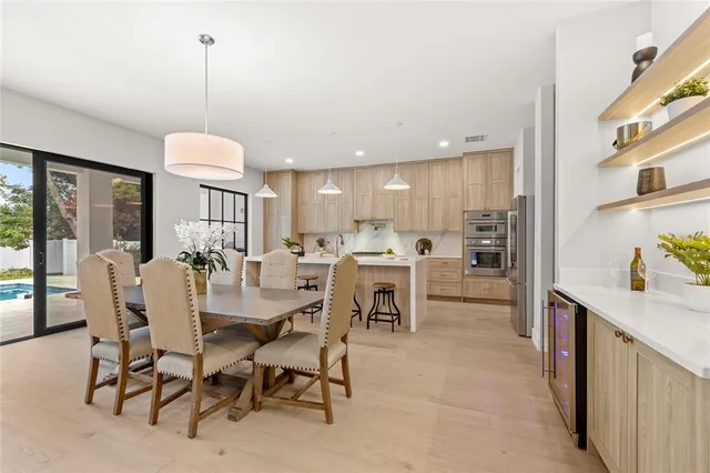 a living room with furniture and wall paintings