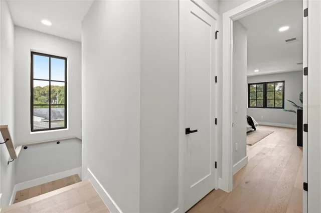 a bathroom with a double vanity sink toilet mirror and shower