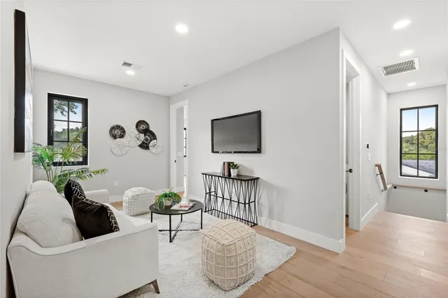a spacious bathroom with a double vanity sink a mirror and shower
