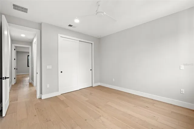 a kitchen with granite countertop a stove sink and cabinets