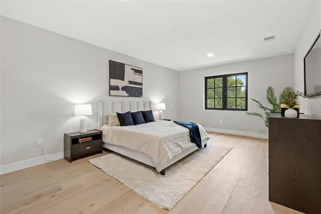 an aerial view of a house with a yard and lake view