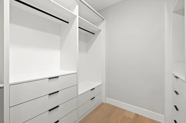 an aerial view of a house with a yard and garden