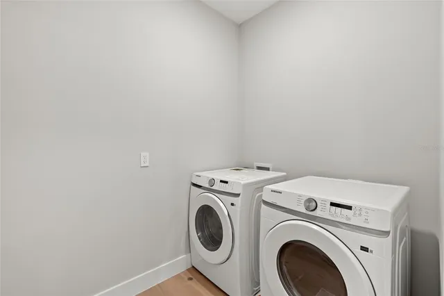 a picture of a bathroom with a shower and a mirror