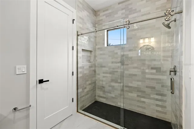 a bathroom with a double vanity sink and a mirror