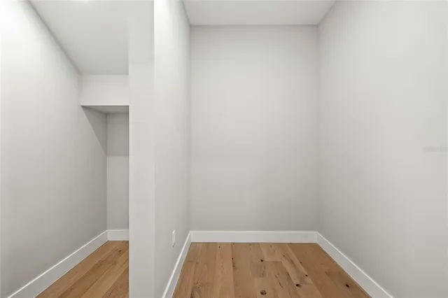 a kitchen with stainless steel appliances a stove a sink and a cabinets