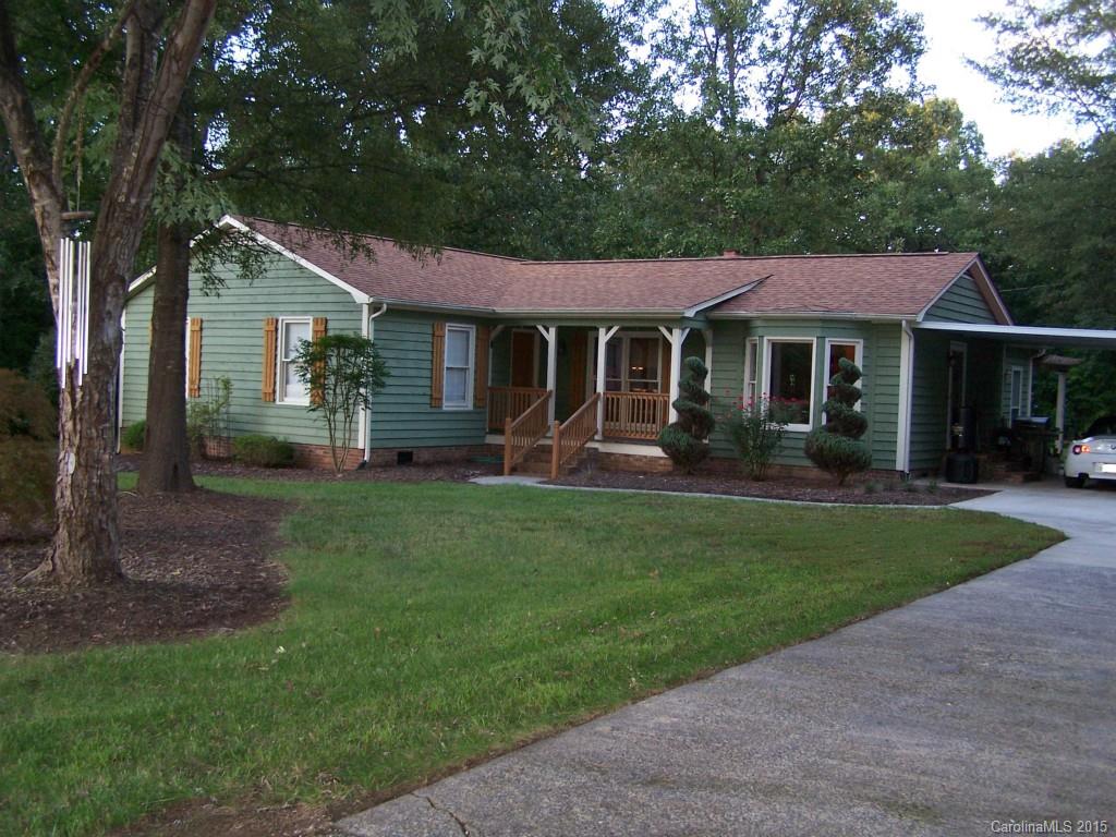 4521 Stack Road Monroe, NC 28112 - Photo 1 of 24 a front view of a house with a garden and trees