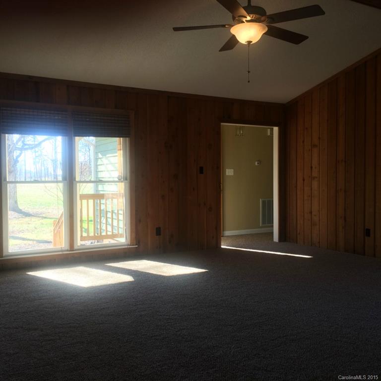 4521 Stack Road Monroe, NC 28112 - Photo 16 of 24 a view of a livingroom with a ceiling fan and window