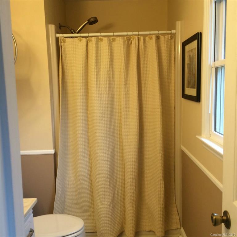4521 Stack Road Monroe, NC 28112 - Photo 19 of 24 a bathroom with a shower and a toilet
