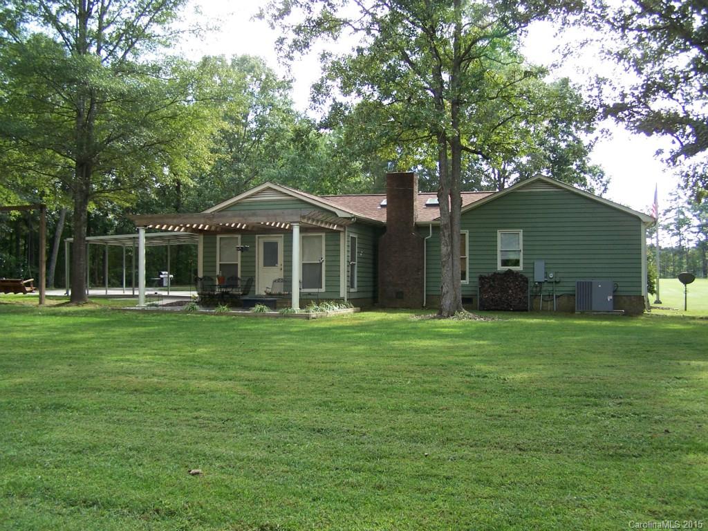 4521 Stack Road Monroe, NC 28112 - Photo 5 of 24 a front view of a house with a garden