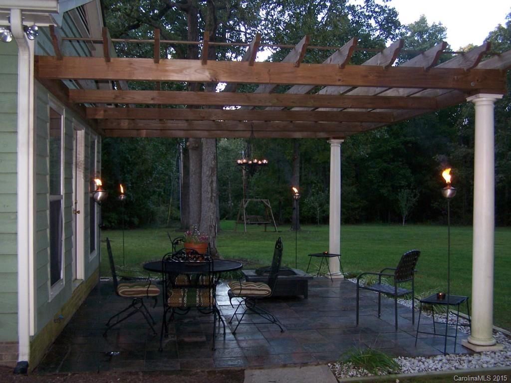 4521 Stack Road Monroe, NC 28112 - Photo 9 of 24 a view of a chairs and table in patio with a yard