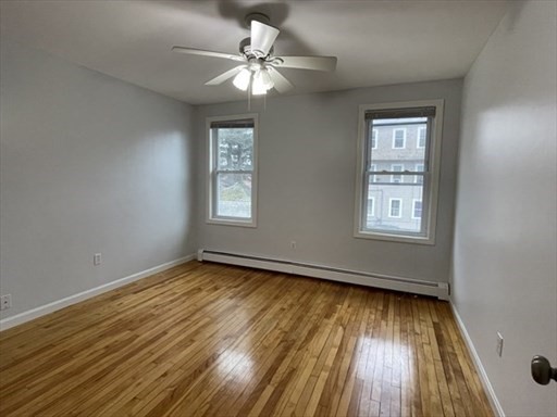 57 Vale Street, Unit 2 Worcester, MA 01604 - Photo 12 of 13 wooden floor in an empty room with a window