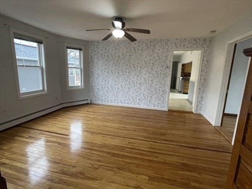 57 Vale Street, Unit 2 Worcester, MA 01604 - Photo 6 of 13 a view of an empty room with window and wooden floor