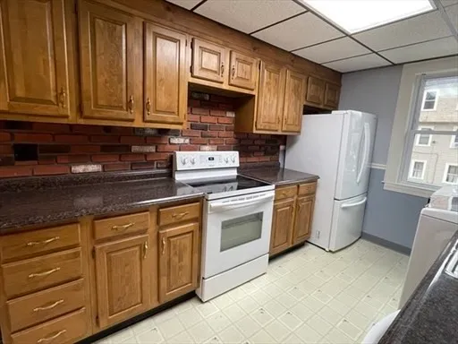 a kitchen with a stove microwave and refrigerator