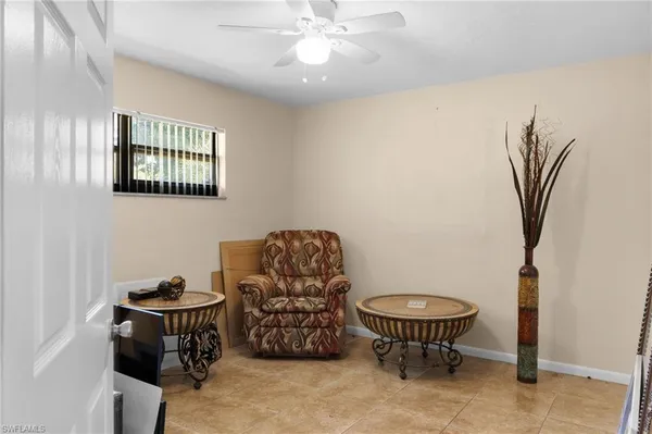 a view of a livingroom with furniture and a chandelier