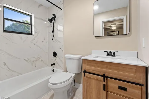 a bathroom with a sink a toilet and a bathtub