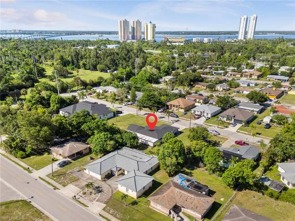 an aerial view of residential houses with outdoor space