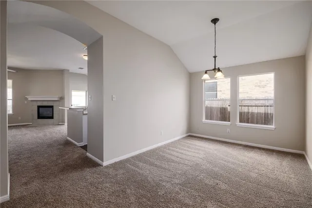 a view of empty room with windows