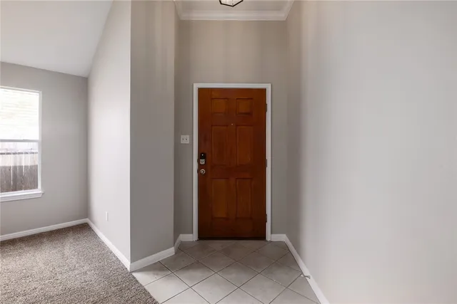 an entryway view with wooden floor