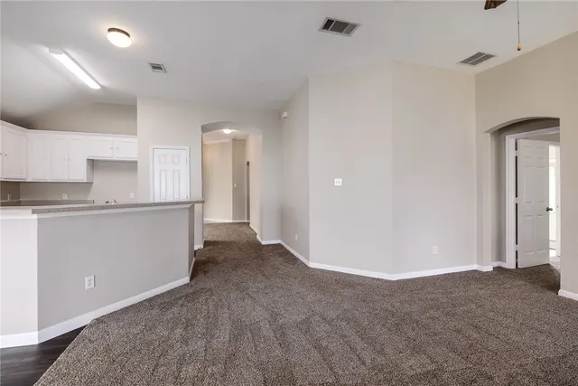 a view of a kitchen with a sink and cabinets