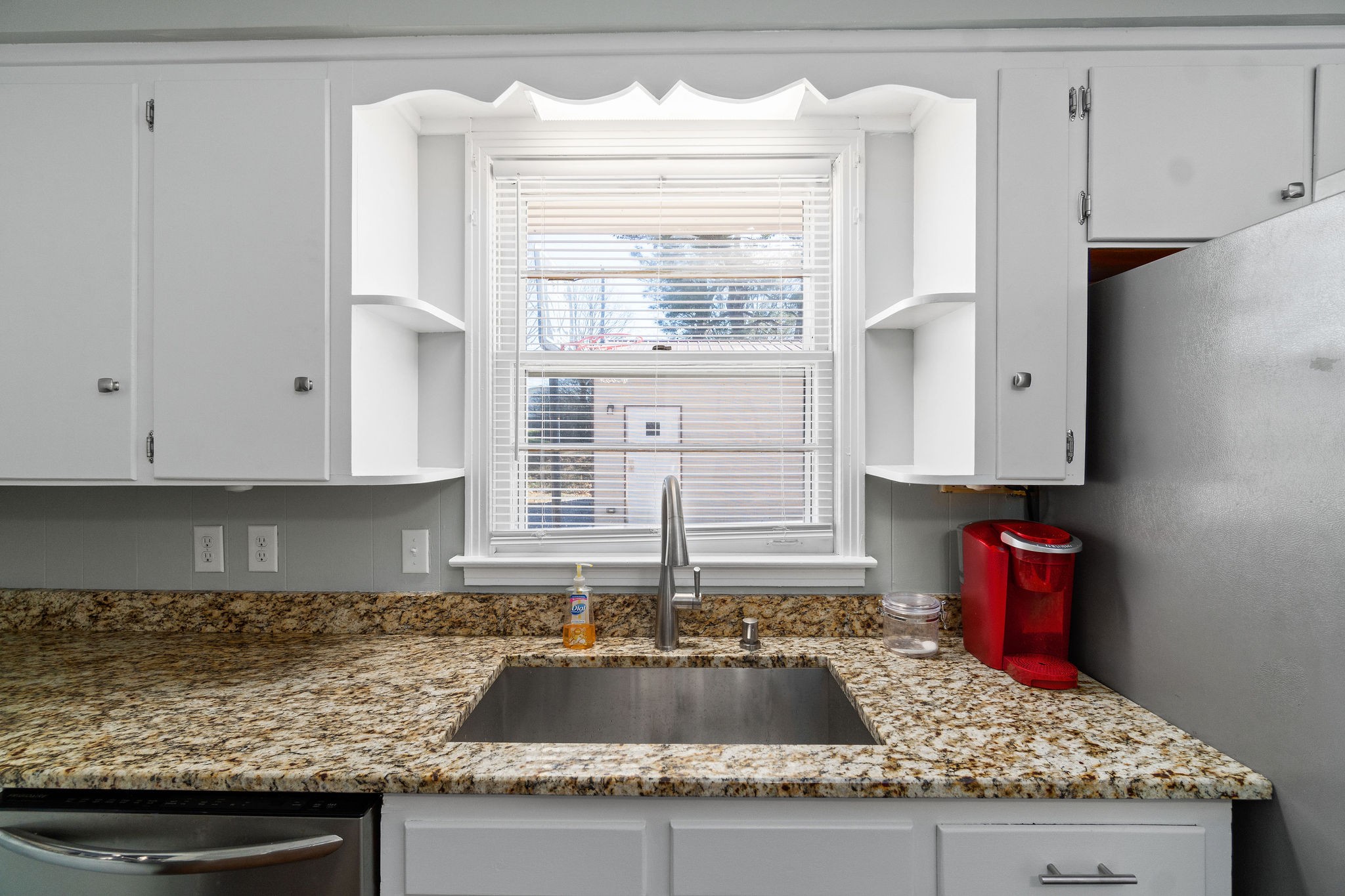 2084 Landon Road Clarksville, TN 37043 - Photo 8 of 24 a kitchen with granite countertop a sink stove and window