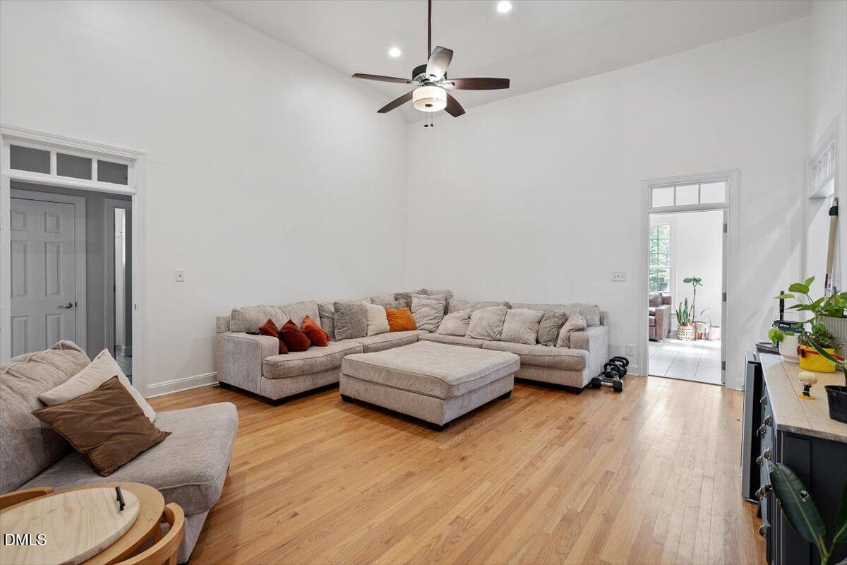 321 Efland - Cedar Grove Road Efland, NC 27243 - Photo 14 of 45 a living room with furniture and a wooden floor