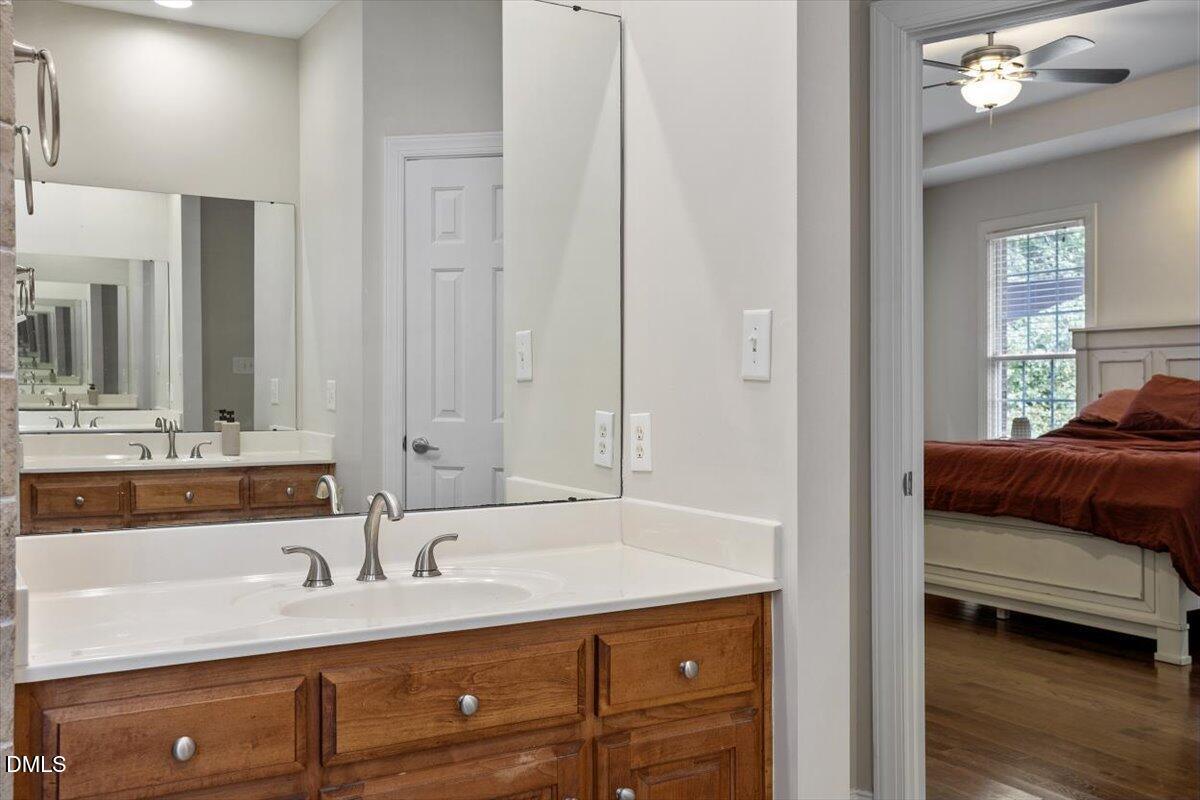 321 Efland - Cedar Grove Road Efland, NC 27243 - Photo 22 of 45 a en suite bathroom with a sink and a mirror