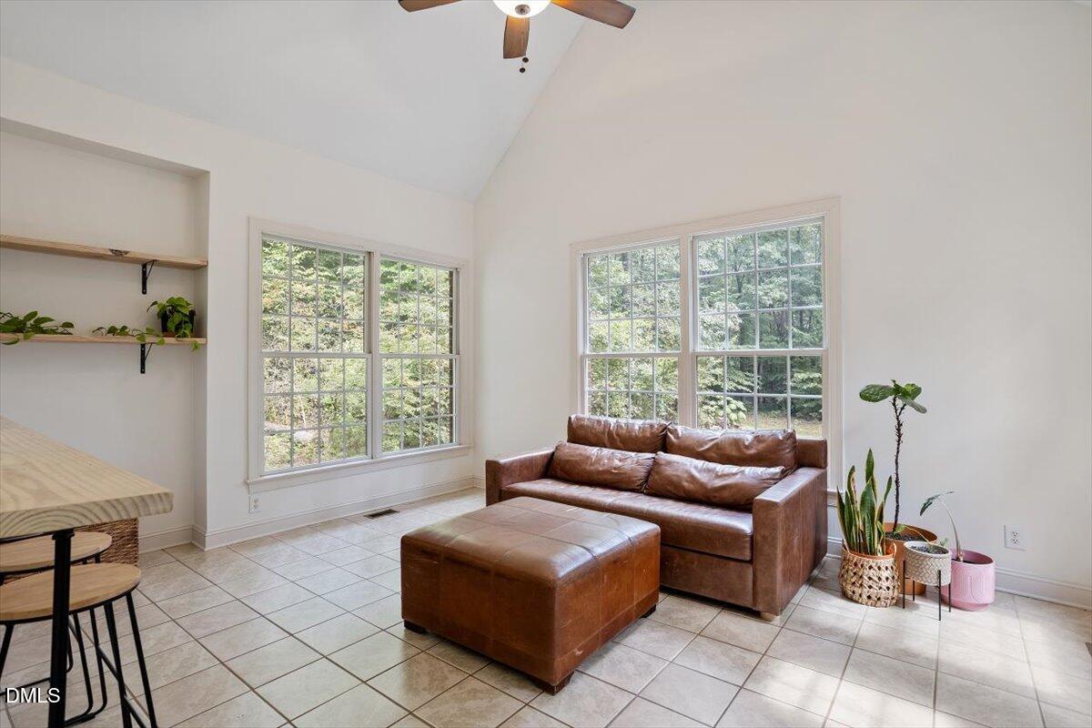 321 Efland - Cedar Grove Road Efland, NC 27243 - Photo 29 of 45 a living room with furniture and floor to ceiling windows