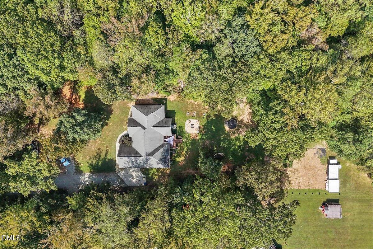 321 Efland - Cedar Grove Road Efland, NC 27243 - Photo 33 of 45 a aerial view of a house with a yard and large trees