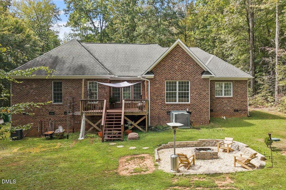 321 Efland - Cedar Grove Road Efland, NC 27243 - Photo 35 of 45 a backyard of a house with barbeque oven