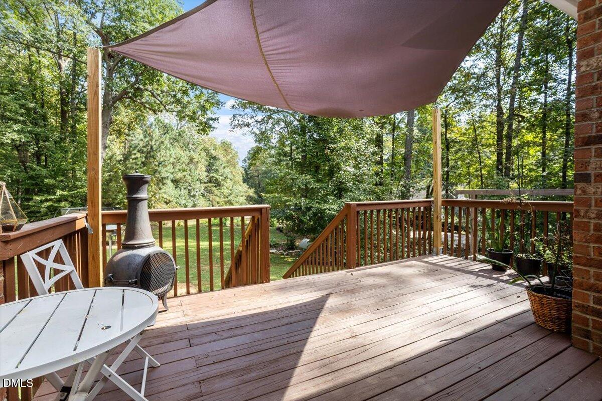 321 Efland - Cedar Grove Road Efland, NC 27243 - Photo 37 of 45 a view of a balcony with wooden floor and outdoor seating