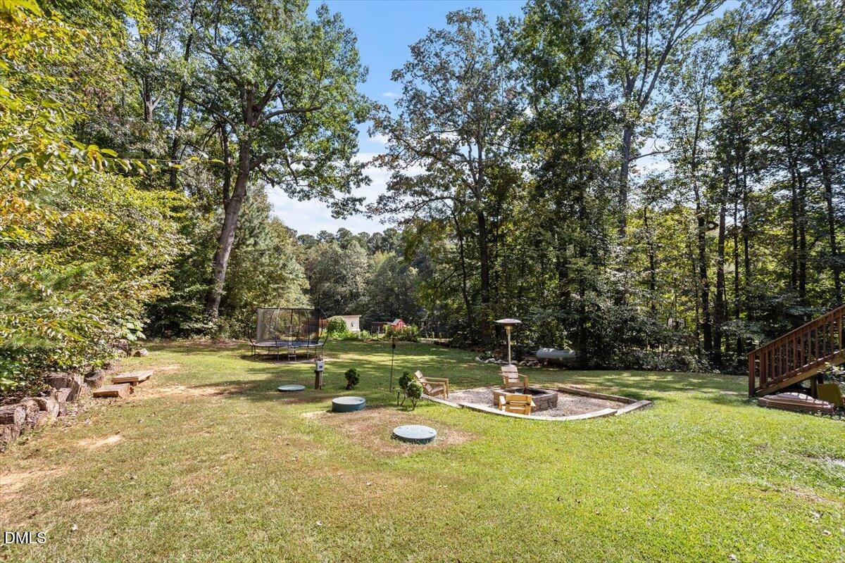 321 Efland - Cedar Grove Road Efland, NC 27243 - Photo 39 of 45 a view of a swimming pool with an outdoor space and seating area