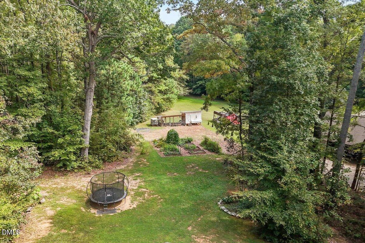 321 Efland - Cedar Grove Road Efland, NC 27243 - Photo 40 of 45 a view of a water fountain in the middle of a garden