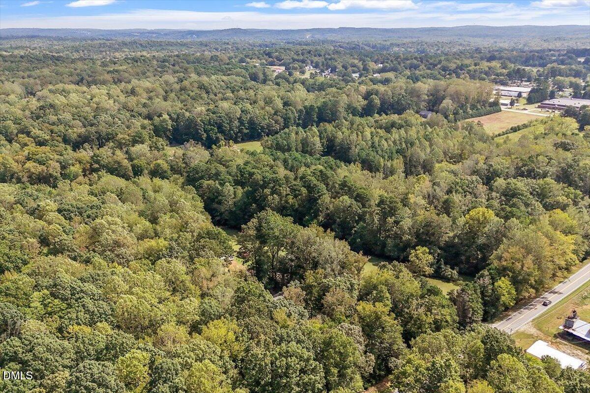 321 Efland - Cedar Grove Road Efland, NC 27243 - Photo 44 of 45 a view of a city with green field