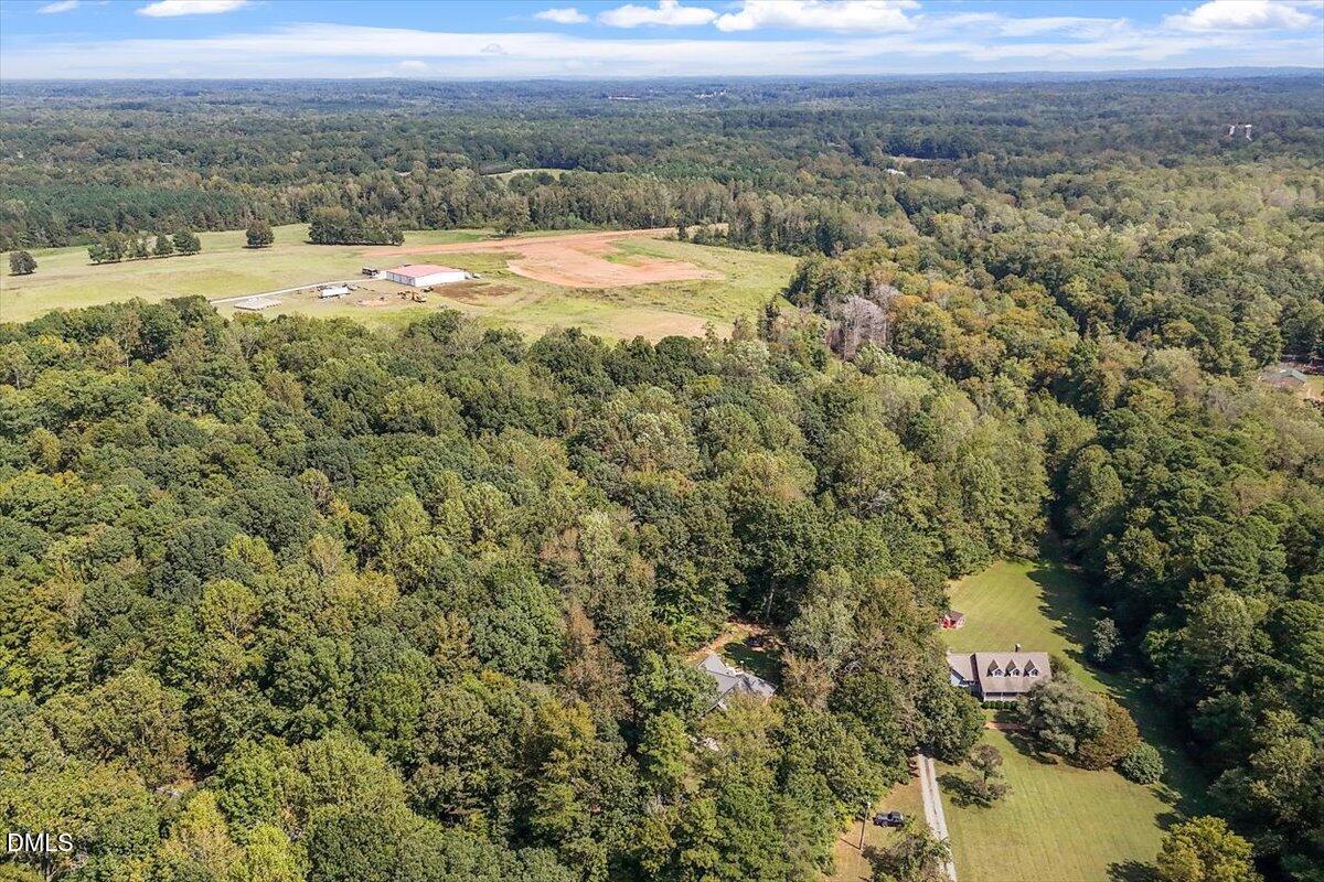 321 Efland - Cedar Grove Road Efland, NC 27243 - Photo 45 of 45 a view of a lake with a city