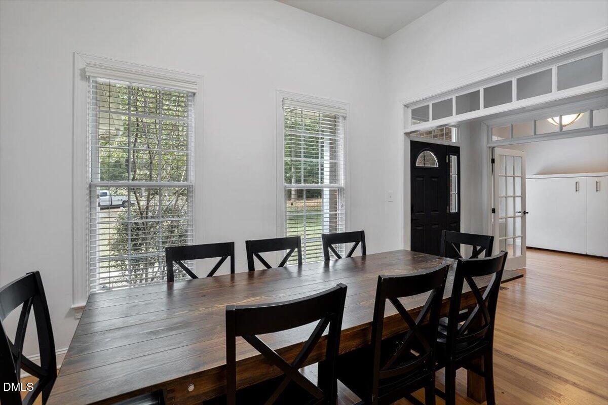 321 Efland - Cedar Grove Road Efland, NC 27243 - Photo 9 of 45 a view of a dining room with furniture and wooden floor