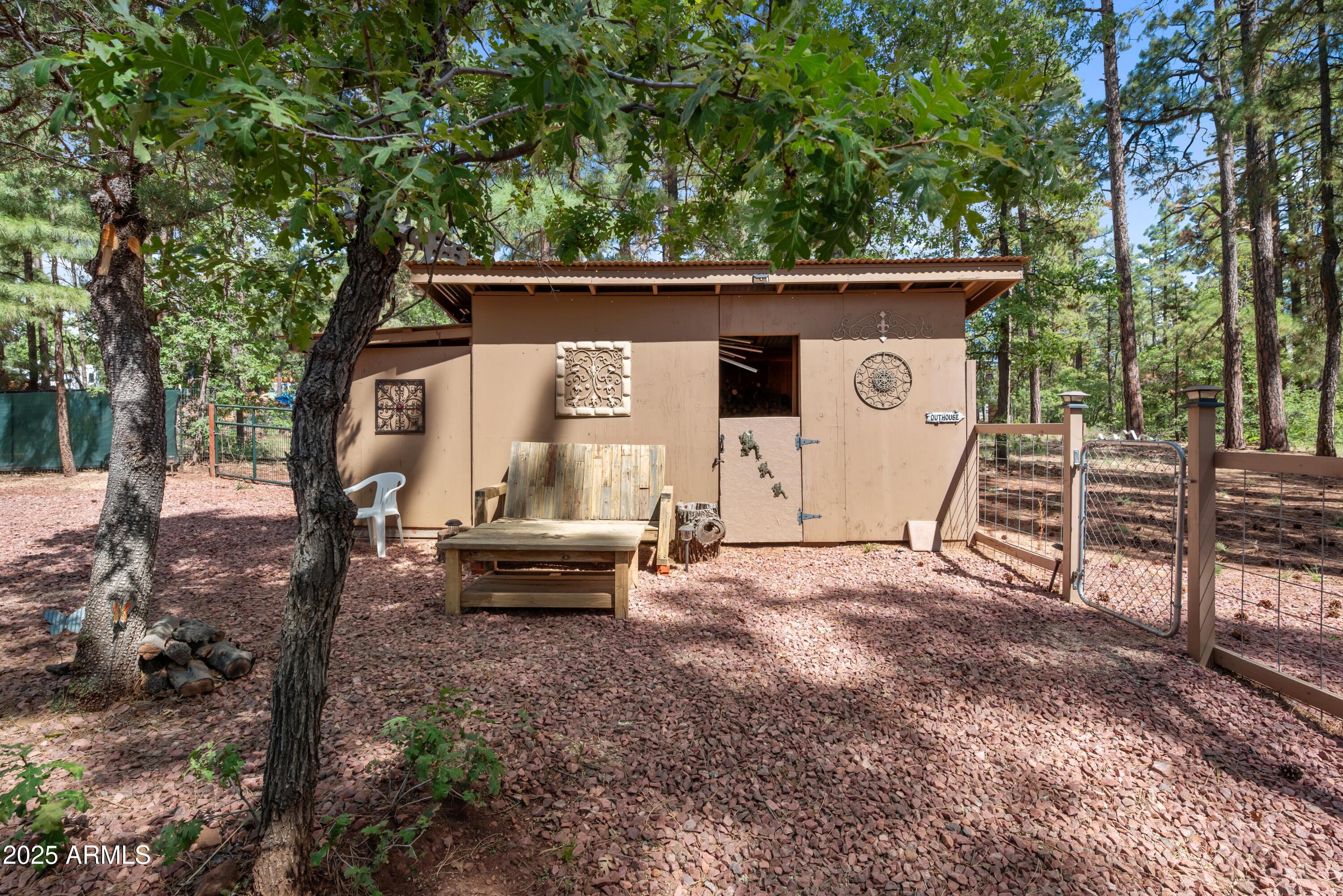 1659 Mormon Road Happy Jack, AZ 86024 - Photo 21 of 46 a view of a house with backyard and sitting area