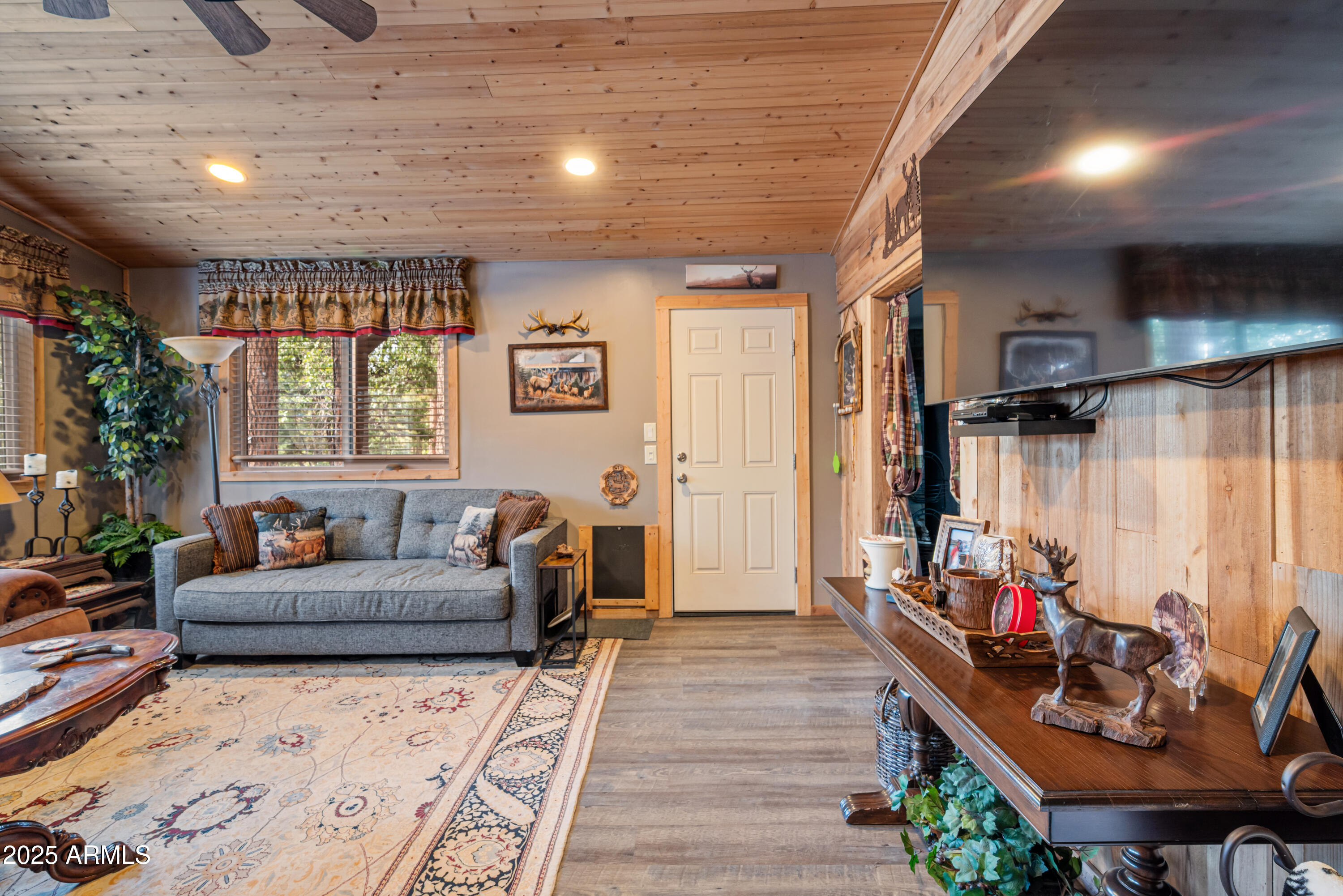 1659 Mormon Road Happy Jack, AZ 86024 - Photo 8 of 46 a living room with furniture and a wooden floor