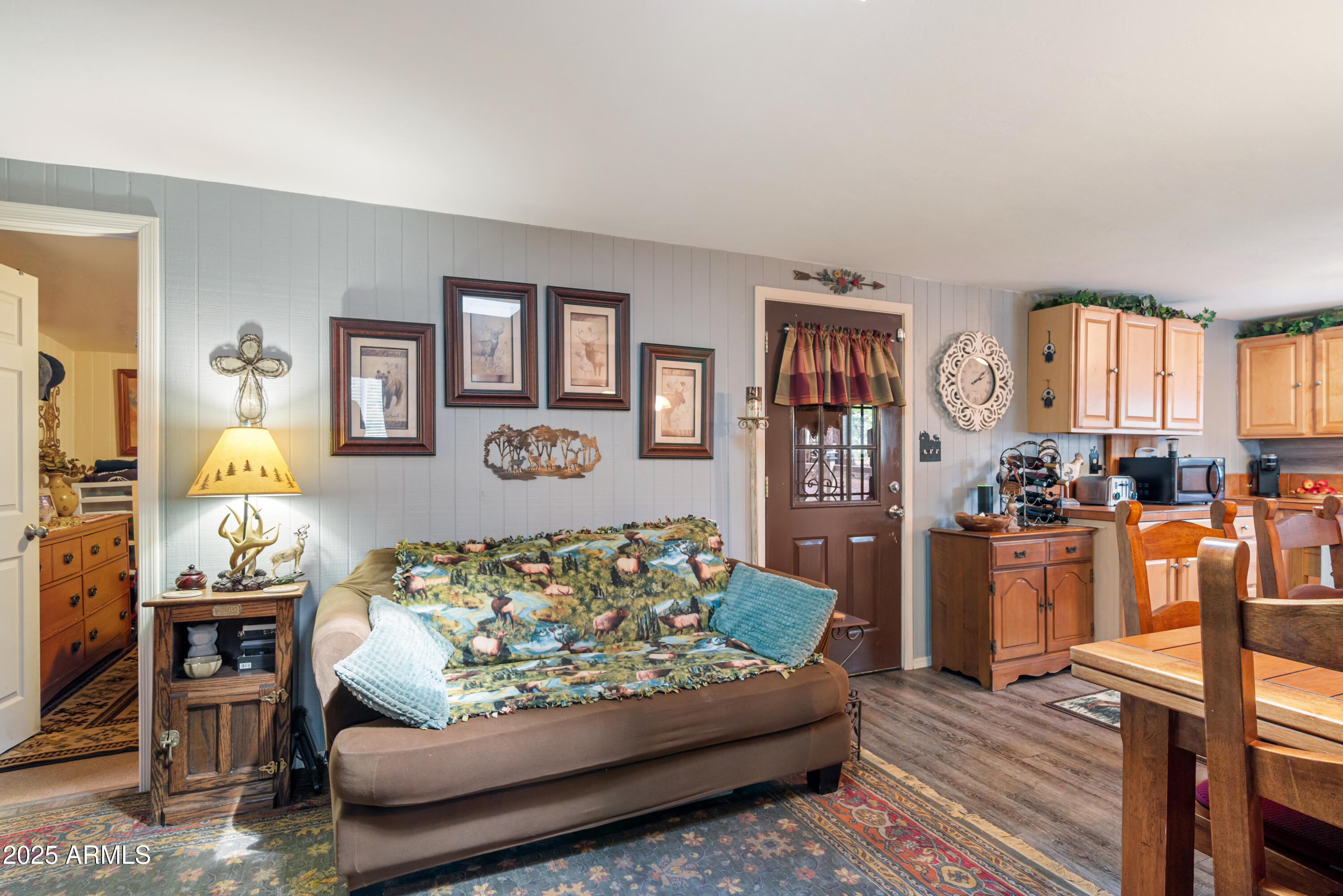 1659 Mormon Road Happy Jack, AZ 86024 - Photo 9 of 46 a living room with furniture fireplace and a window