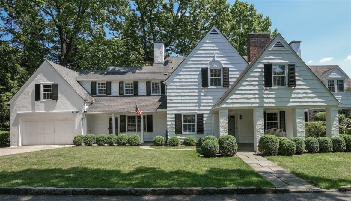 23 Warwick Road Bronxville, NY 10708 - Photo 1 of 1 a front view of a house with a yard and potted plants