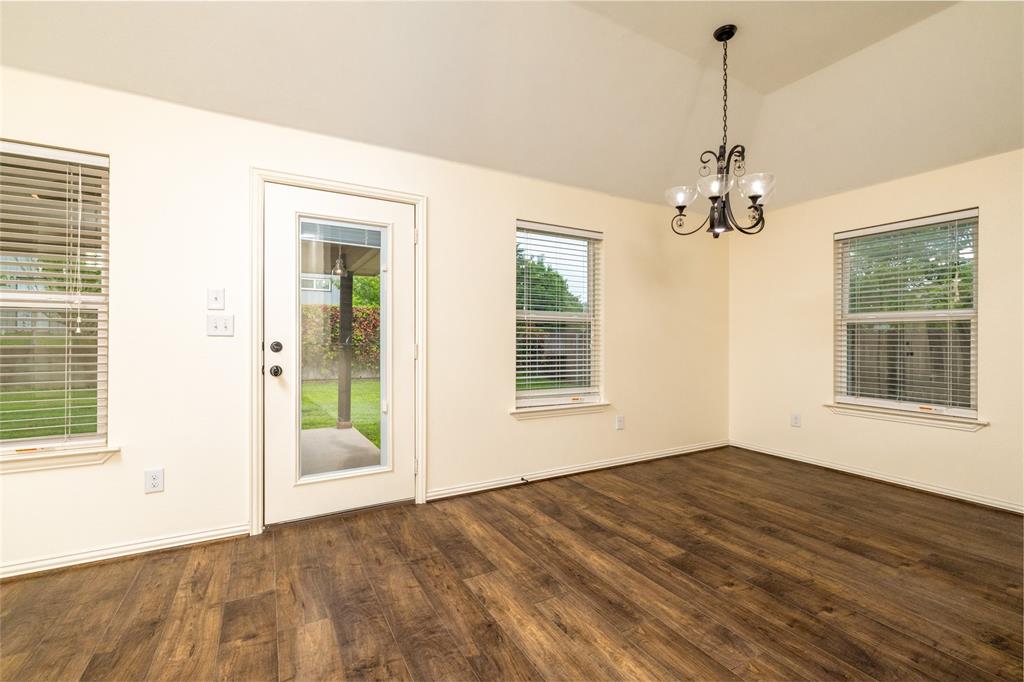 405 Kimbrough Road Azle, TX 76020 - Photo 8 of 39 a view of empty room with window and wooden floor