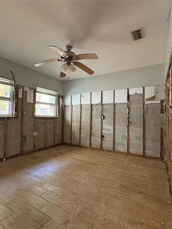 16 Palm Drive Yankeetown, FL 34498 - Photo 29 of 41 an empty room with windows and fan