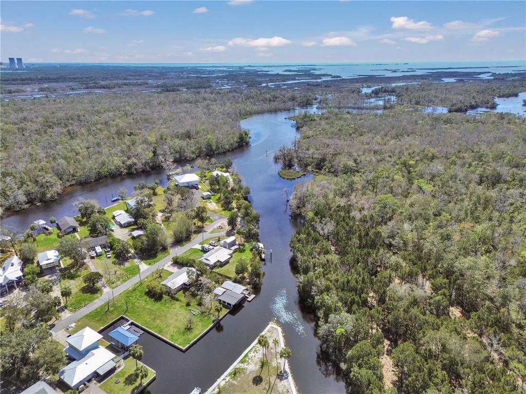 16 Palm Drive Yankeetown, FL 34498 - Photo 3 of 41 an aerial view of a house with a yard and lake view