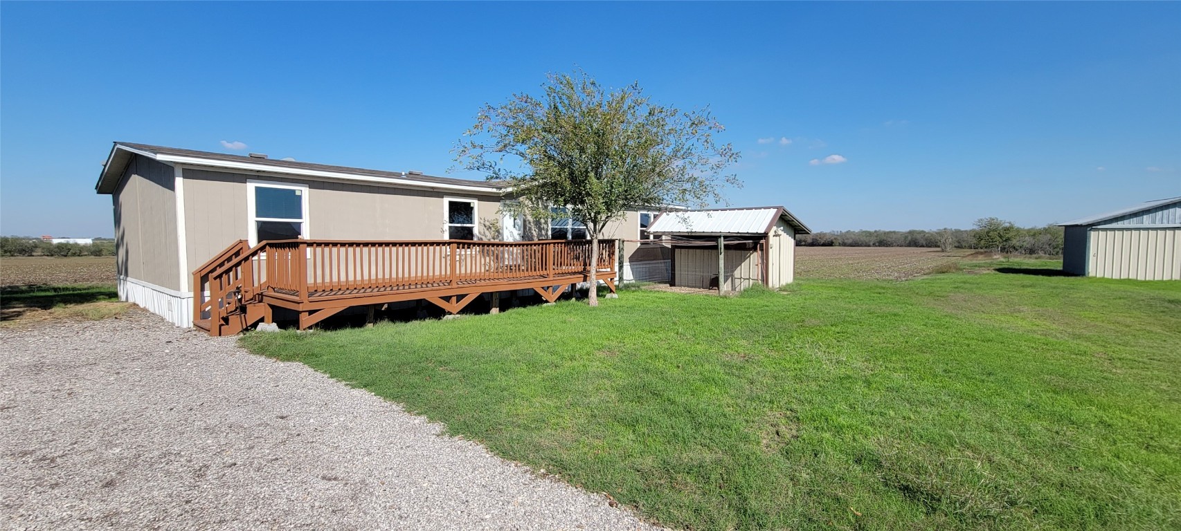 10616 Doyle Road Del Valle, TX 78617 - Photo 1 of 16 a view of a house with backyard and porch