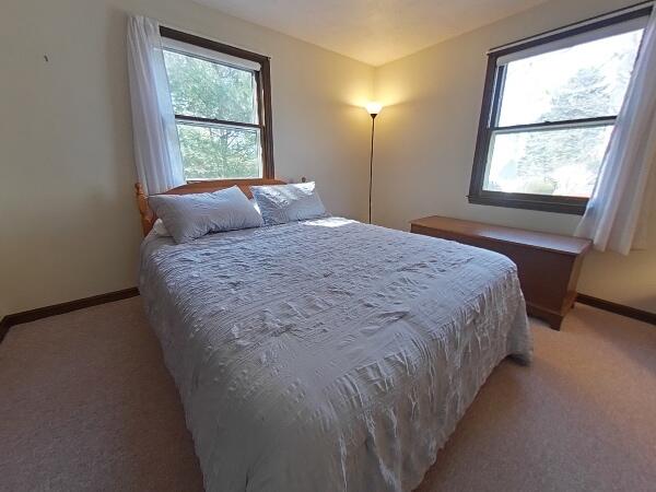 70 Padlock Lane Centerville, MA 02632 - Photo 14 of 23 a large bed sitting in a bedroom next to a window