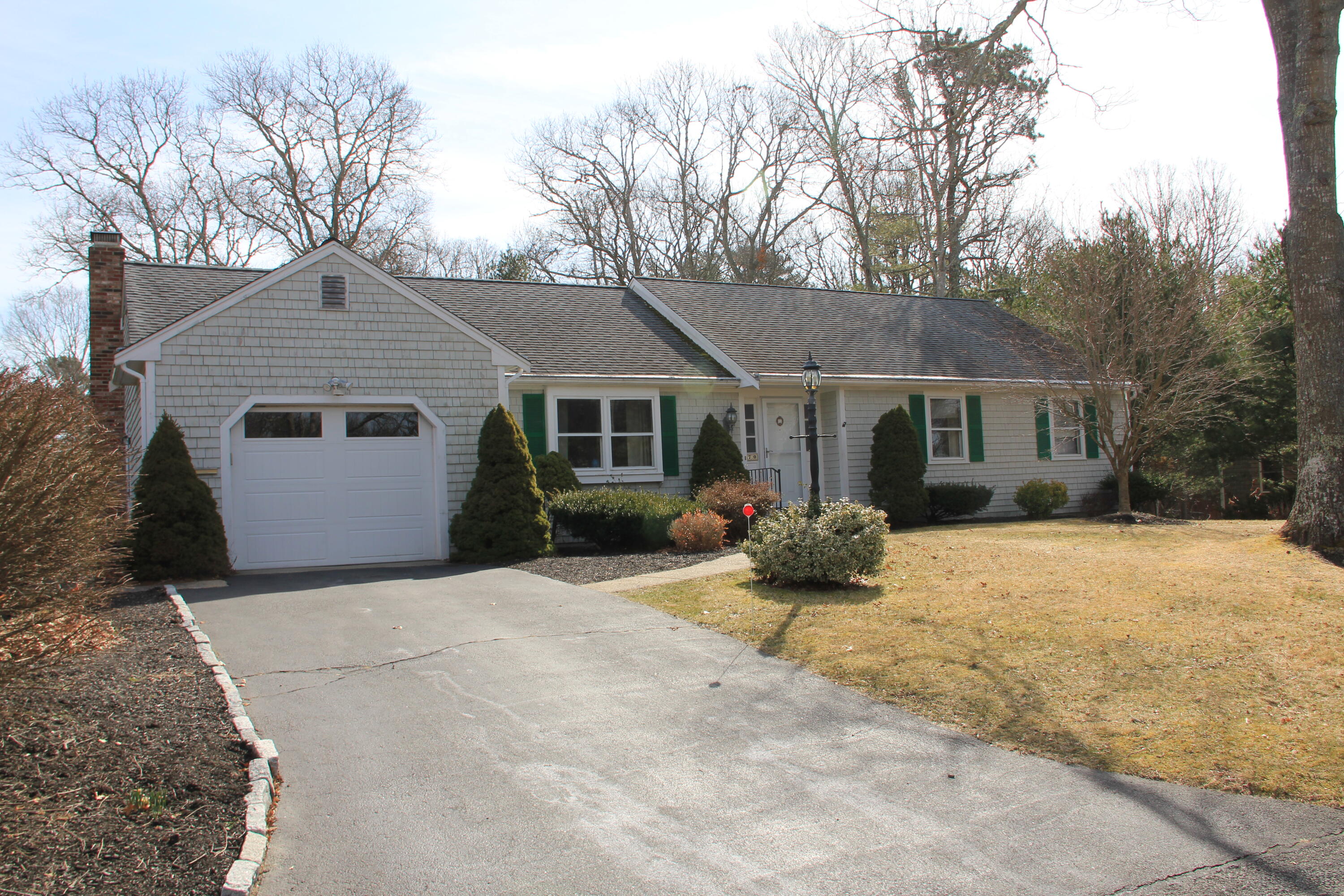 70 Padlock Lane Centerville, MA 02632 - Photo 2 of 23 a view of a house with a yard covered in snow