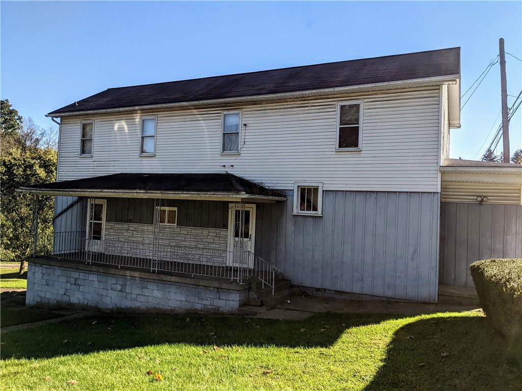 124 Chartiers Road Jefferson, PA 15344 - Photo 1 of 22 a front view of a house with a yard