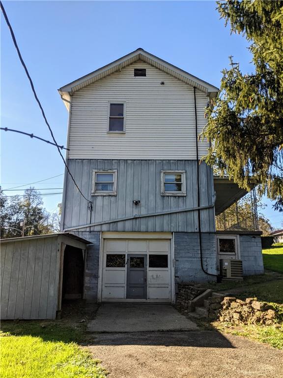 124 Chartiers Road Jefferson, PA 15344 - Photo 2 of 22 a front view of a house with a yard