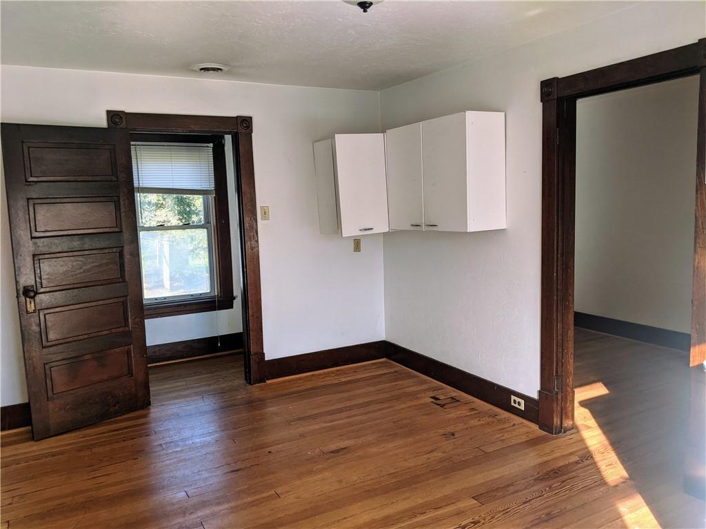 124 Chartiers Road Jefferson, PA 15344 - Photo 20 of 22 a view of empty room with wooden floor and cabinet
