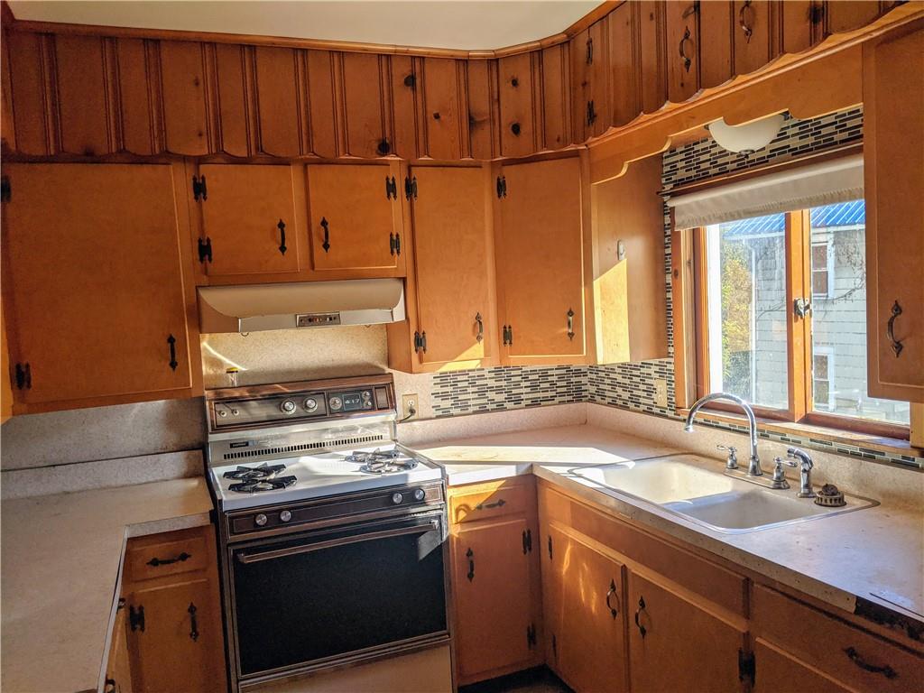 124 Chartiers Road Jefferson, PA 15344 - Photo 5 of 22 a kitchen with a stove and a sink