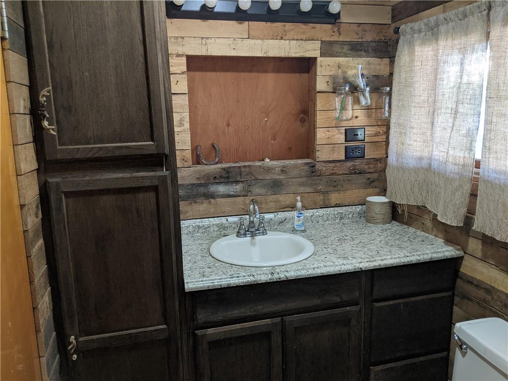 124 Chartiers Road Jefferson, PA 15344 - Photo 8 of 22 a bathroom with a granite countertop sink and a mirror